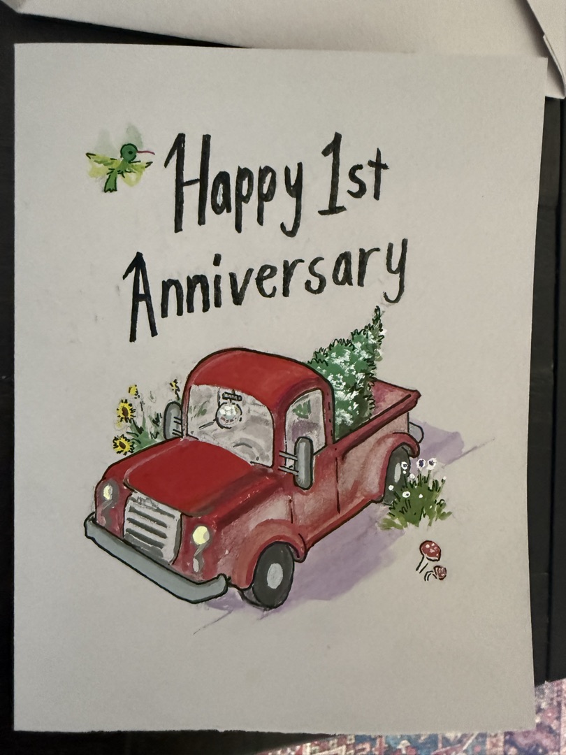 Hand-painted Happy 1st Anniversary card with a vintage red pickup truck carrying a Christmas tree