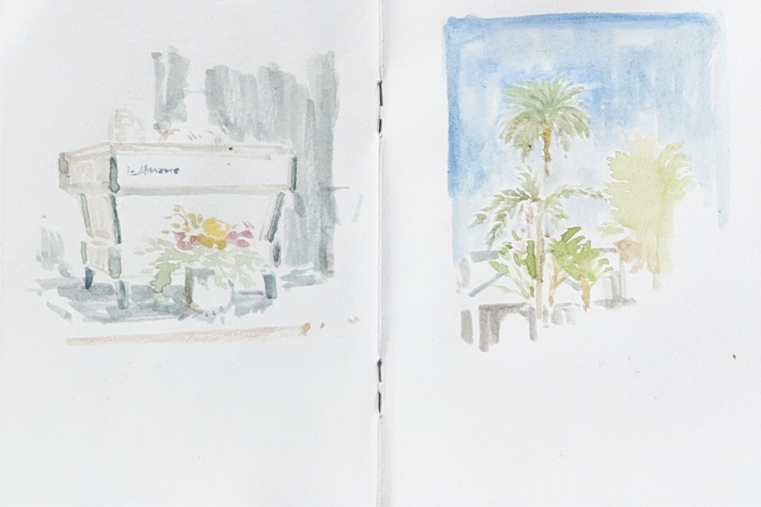 Open watercolor sketchbook with two studies: a flower planter and palm trees against a blue sky